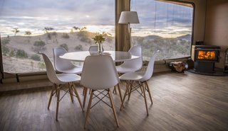 Large fly windows and doors open the interiors up to the outdoors.