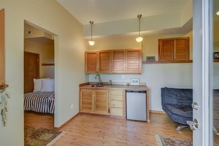In 1998, the cabin was expanded to include a living room, master bedroom, and a guest suite on the lower level. Here is the guest suite with a living area on the right and bedroom to the left.