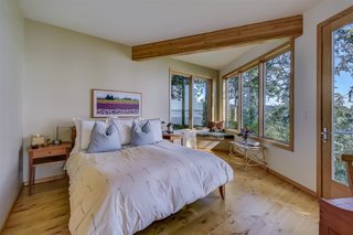 A built-in window seat in the corner of the master bedroom overlooks views in two directions.