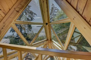 The cabin’s original architecture and expansion were carefully designed to capture panoramic views from every room.