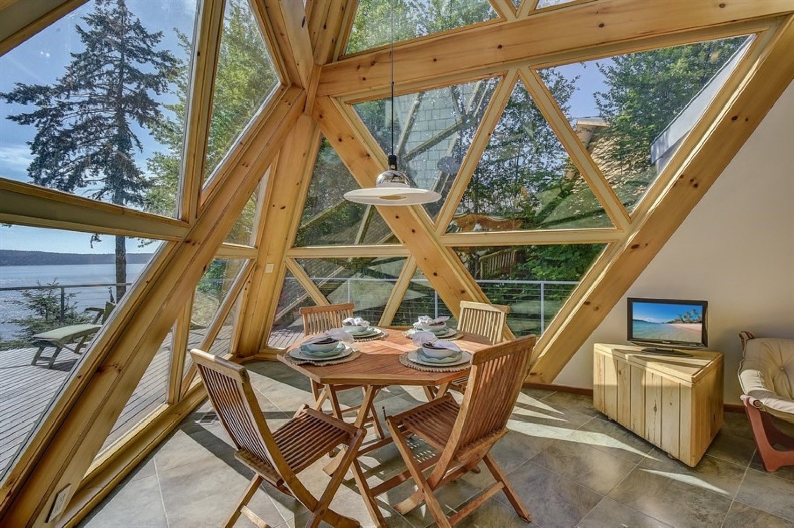 Bathed in natural light, the dining area is located in the most architecturally striking part of the home.

