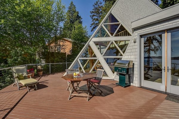 Timber shingle siding emphasize the home&rsquo;s breezy, seaside aesthetic on Whidbey Island.

