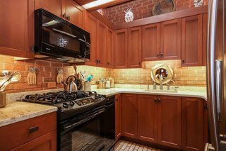 Dexter Builders remodeled the kitchen in 2006, which includes updates like custom cabinetry, new appliances, and granite countertops.