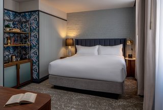 The standard King Room offers courtyard rooms and TRI-KES wallcovering.