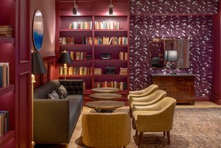 The Press Room is dressed with leather and velvet furnishings, antiques, books and typewriters.