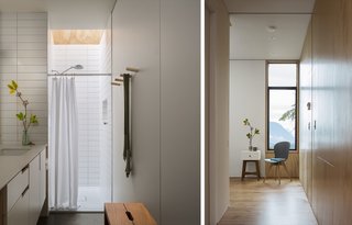 The upstairs bathroom features a shower illuminated by a skylight.