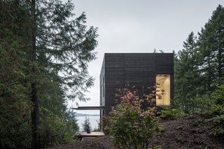 The home is approached from the south with views of Hood Canal below.