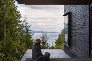 The entry is marked by a thin, cantilevered canopy hovering over the front porch.