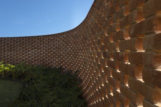Concrete and steel reinforcements have been embedded into the interior of the brick wall for added stability.