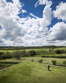 The green roof of the linear home, which is located on the property's highest point, was planted with grass to match the surrounding landscape.