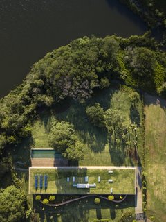 In this aerial photograph, solar panels and skylights can be seen on the green roof.