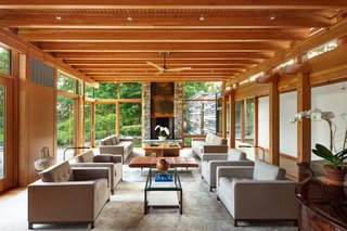 Amy Aidinis Hirsh smartly dressed the contemporary interiors with furnishings of varying shades of gray to balance the warm timber hues.