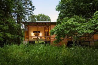Three en-suite bedrooms are located in the volume on the east side of the property, while the remaining two en-suite bedrooms and garage are housed in the northernmost volume.