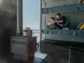A wood-burning stove helps create a cozy and toasty atmosphere.