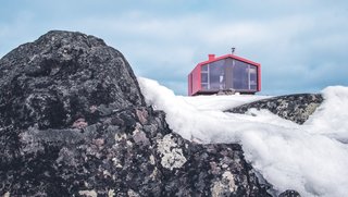 The cabin is perched less than 100 feet away from a clear lake. The region is renowned for its miles of hiking trails, skiing, and other outdoor recreation opportunities.
