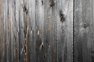The exterior larch facade was treated using Shou Sugi Ban, an ancient Japanese exterior siding technique that involves charring the surface to preserve and protect the wood.