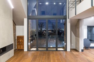 Operable Luxal glazing opens up to a small terrace.