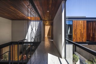 A continuous connection with the outdoors is maintained through full-height glazing.
