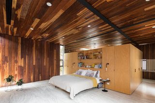 A look at the master bedroom, which unlike the other rooms in the home, features Ipe wood for both the ceiling and walls.