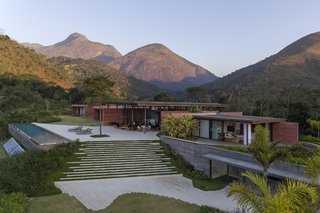 Lush greenery surrounds Casa Terra to make the building feel like an extension of the landscape.