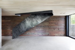 The ground floor on the north side of the home is partly buried into the earth for better energy conservation.