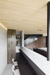 Separated by a level change, a small office can be found behind the living area.
