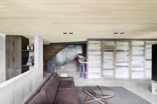 The repurposed divider slides into place and helps trap heat generated from the wood-burning fireplace.