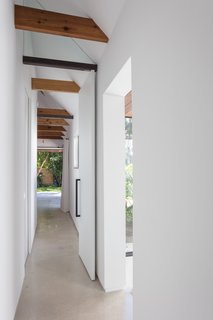 A look down the beamed, light-filled hallway in the new addition.