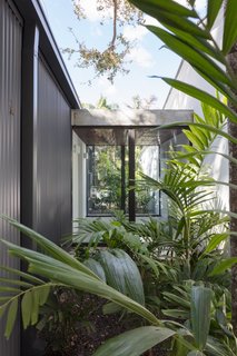 Gardens planted on both sides of the vestibule provide privacy, as well as an immersive jungle-like experience.