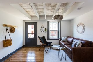 To give the interior a more open and spacious feel, the team exposed the ceiling beams. 