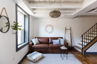 Thanks to the new large windows and crips white paint, the living room now encompasses a fresh, inviting atmosphere.