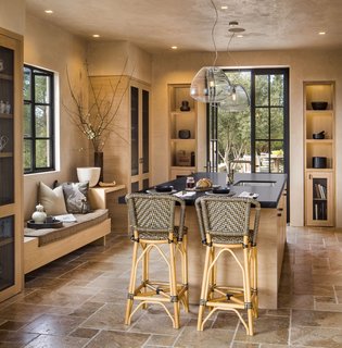 The light-filled kitchen features custom cabinetry by a local millwork shop.