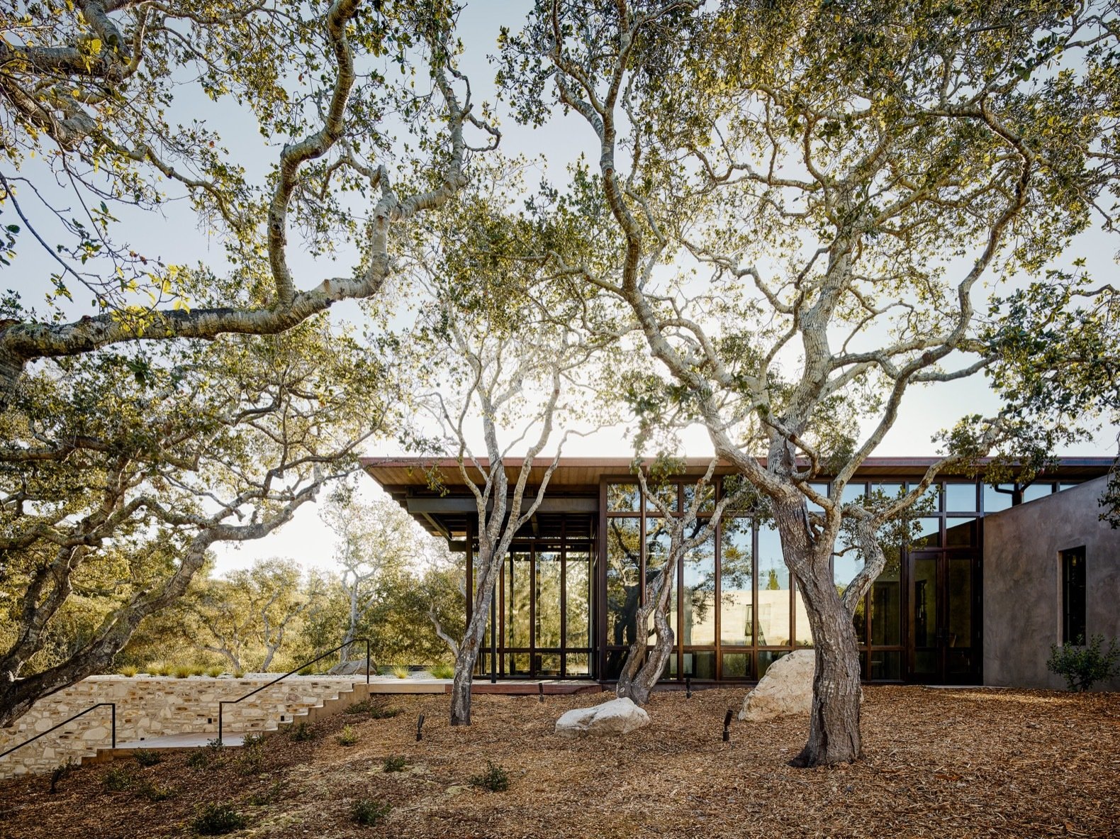 The existing driveway was rerouted to a lower elevation, and the garage tucked underground so as not to detract from the surrounding views.