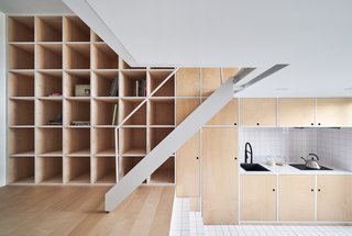 The minimal kitchen includes a sink and electric stovetop.