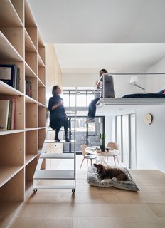 The apartment opens up to a small terrace through glazed doors.