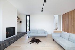Tongue-and-groove Piccolo oak flooring is used throughout the home to create continuity between the existing house and the new extension. The gas fireplace is by Clean Face.