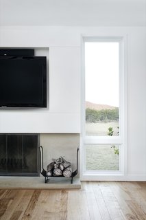 White walls are paired with locally sourced pecan flooring.