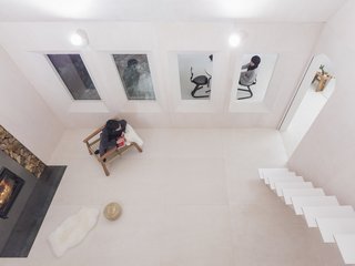 The view from the loft space down to the living room and dining area next door.