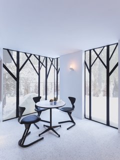In contrast to the living area, the dining room is painted white and features tiled floors.