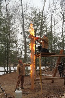 The siding of the cabin has been charred by hand using the Shou Sugi Ban technique.