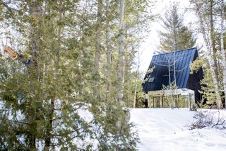 The 700-square-foot cabin features a steeply pitched roof that is nearly 23 feet in height.