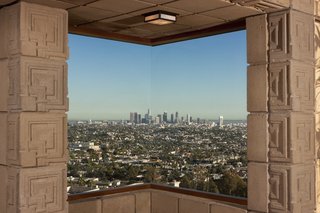 One of three corner windows in the home frames panoramic views of the Los Angeles Basin.