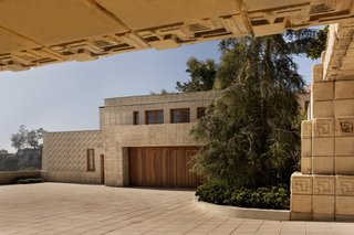 A courtyard separates the main residence from the detached garage, and is topped with guest quarters, which was originally a chauffeur’s apartment.