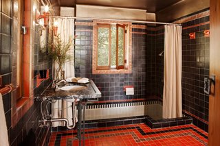 Each of the bathrooms features a soaking tub and different patterned tile.