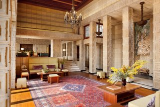 The drama of the exterior is matched by a breathtaking interior, where soaring ceilings and large stained-glass windows bring ample natural light and connection to the landscape indoors.