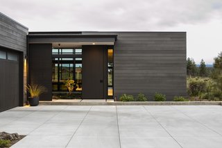 "Sliding and swinging panels enable spaces to expand and contract as needed for the owners, a few guests, or large gathering," say the architects. "At the entry courtyard, a rolling screen and swinging gate can be configured to be cozy and private, or wide open and welcoming."