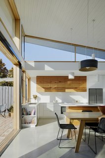 The kitchen's overhead cabinets have been built from solid timber recycled from re-milled Messmate hardwood floorboards.