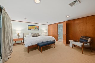 This spacious, ensuite bedroom is accessed from the vestibule.