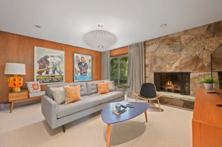 With fewer glazed openings than the other rooms in the house, the compact den offers a more intimate setting.