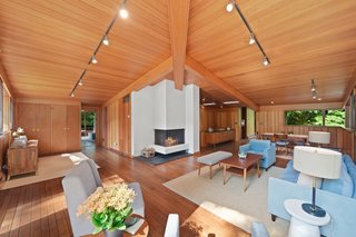 A wide view of the great room reveals the hallway, located off to the right, and a glimpse of the master suite to the left.